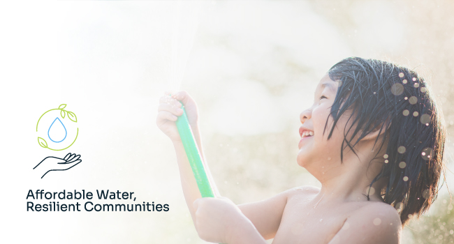 girl playing with watering hose